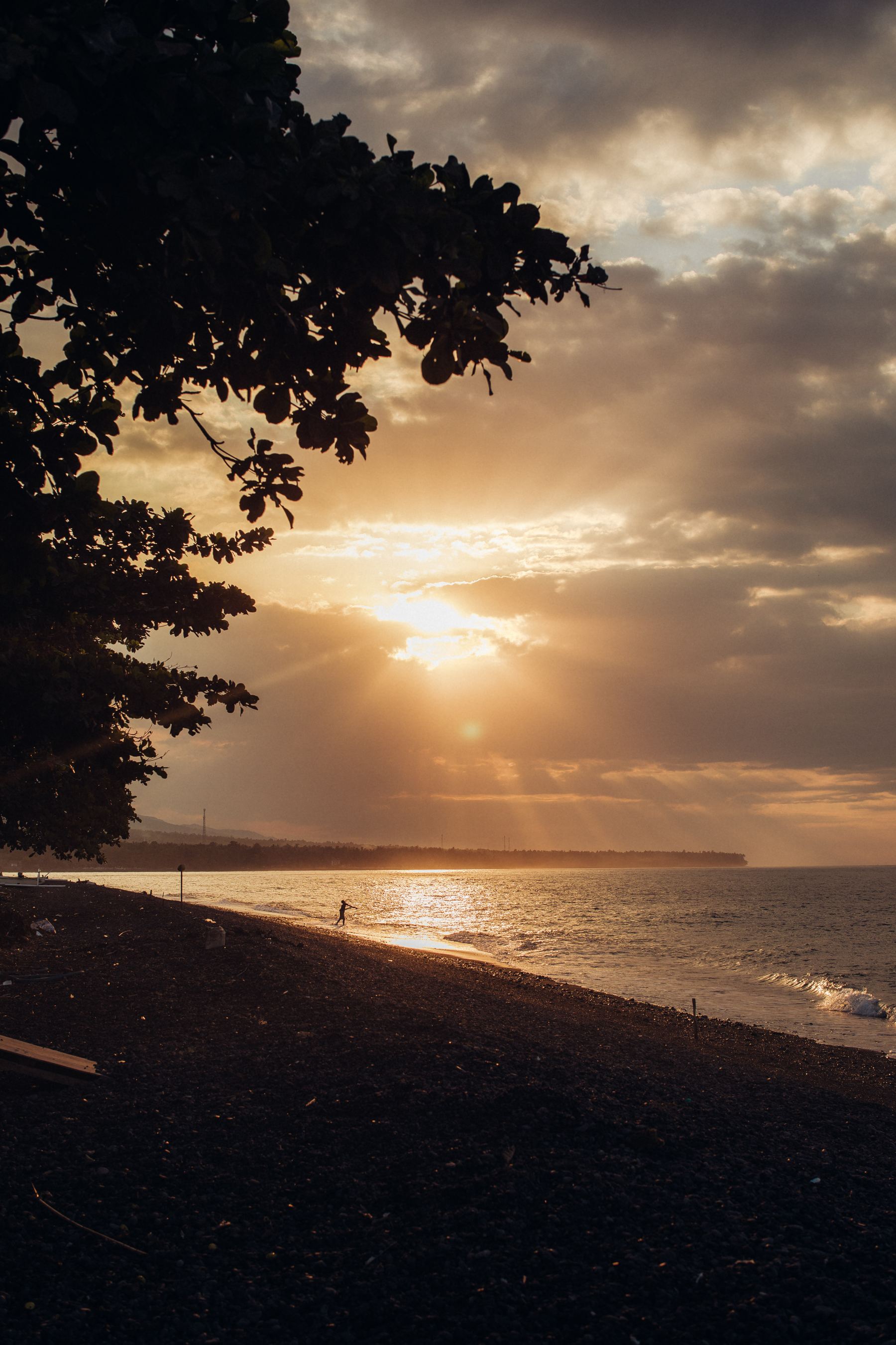 Golden sunset over the Tianyar coast