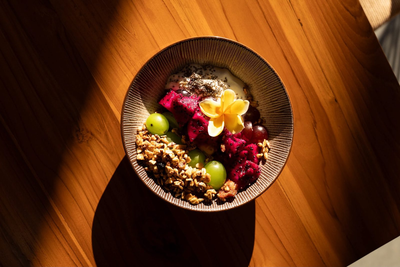 A fresh breakfast bowl with fruit and granola at Saga