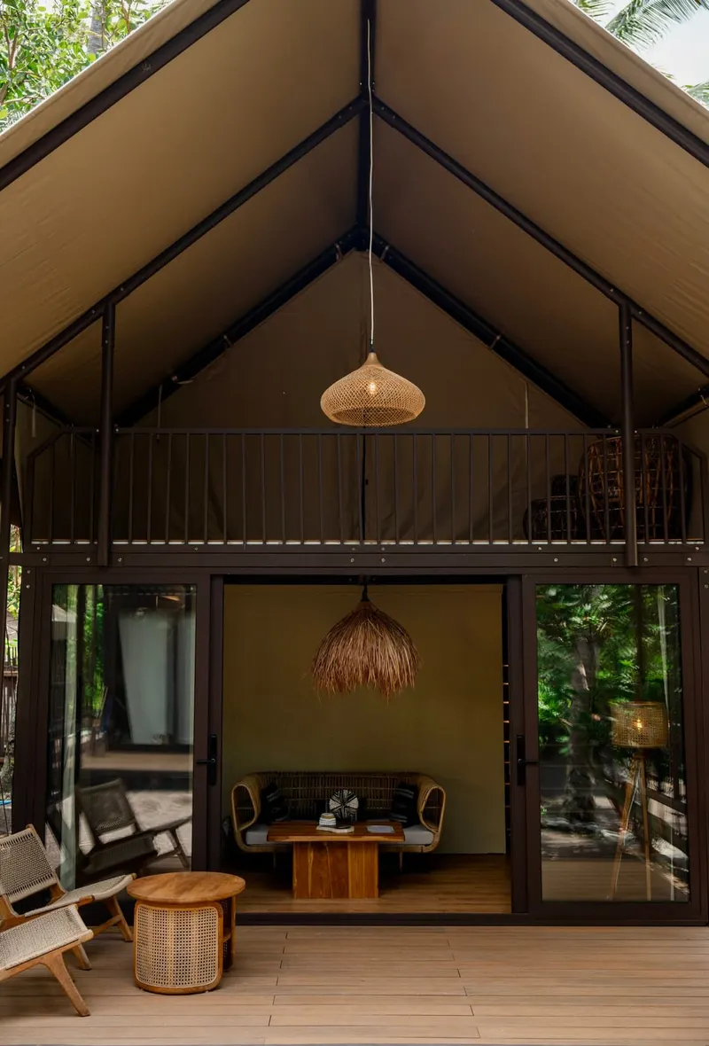 Arta from the front: the lounge on the ground floor, the balcony above, two woven lamps