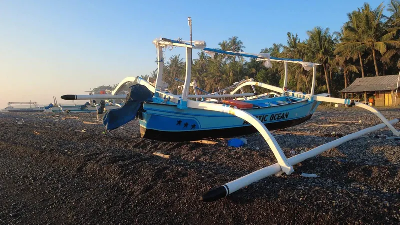 A jukung on the pebble shore at Tianyar